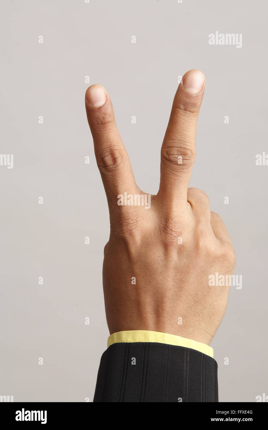 https://c8.alamy.com/comp/FFXE4G/businessman-showing-close-up-of-hand-with-two-index-and-middle-finger-FFXE4G.jpg