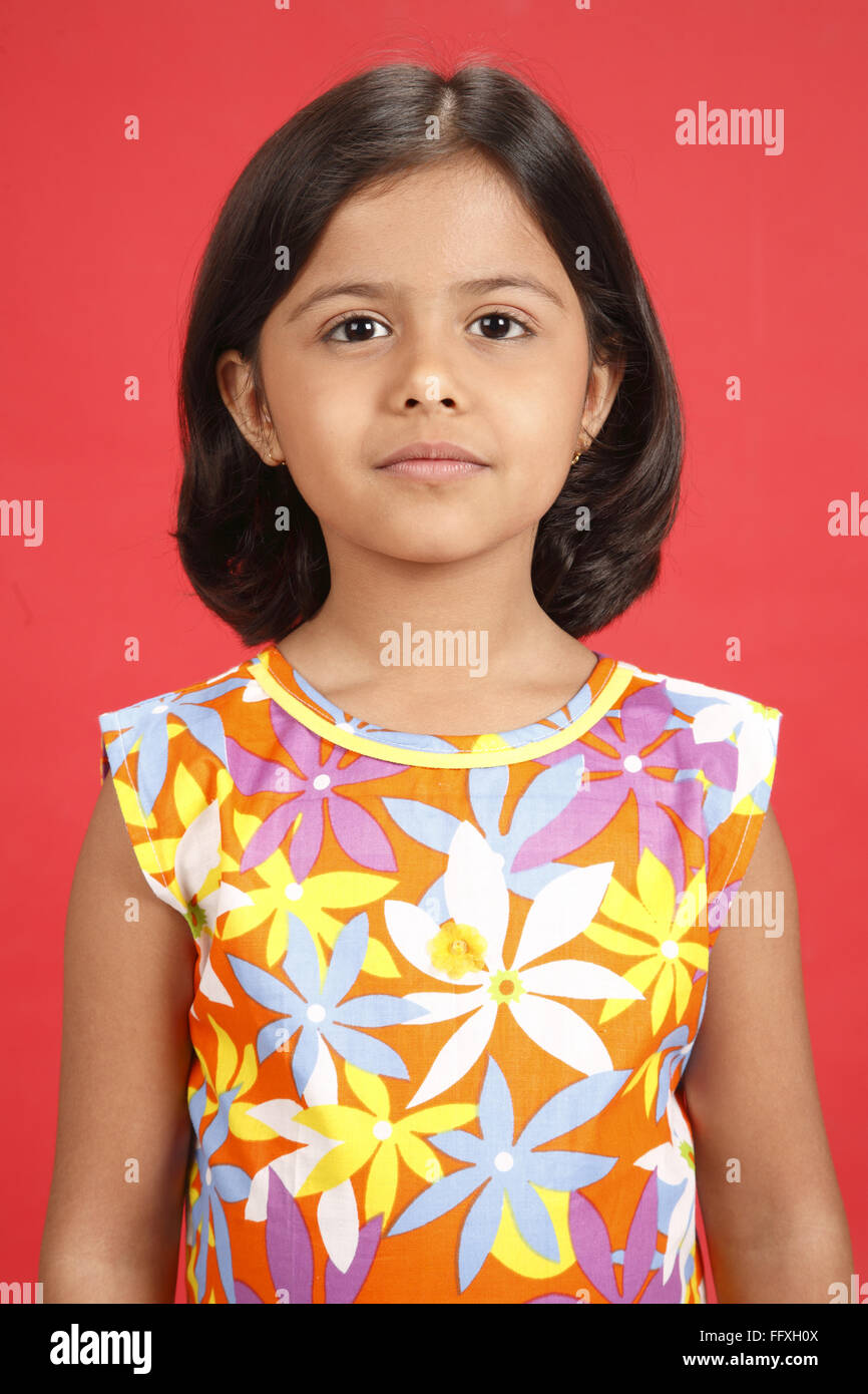 Eight year old girl looking at camera MR#703U Stock Photo