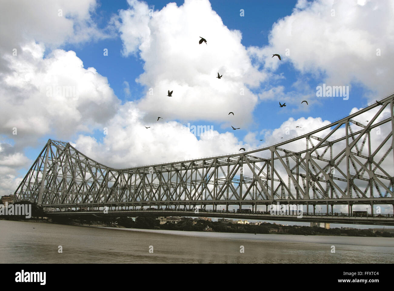 Kite Birds flying and Howrah Bridge at Calcutta , West Bengal , India Stock Photo