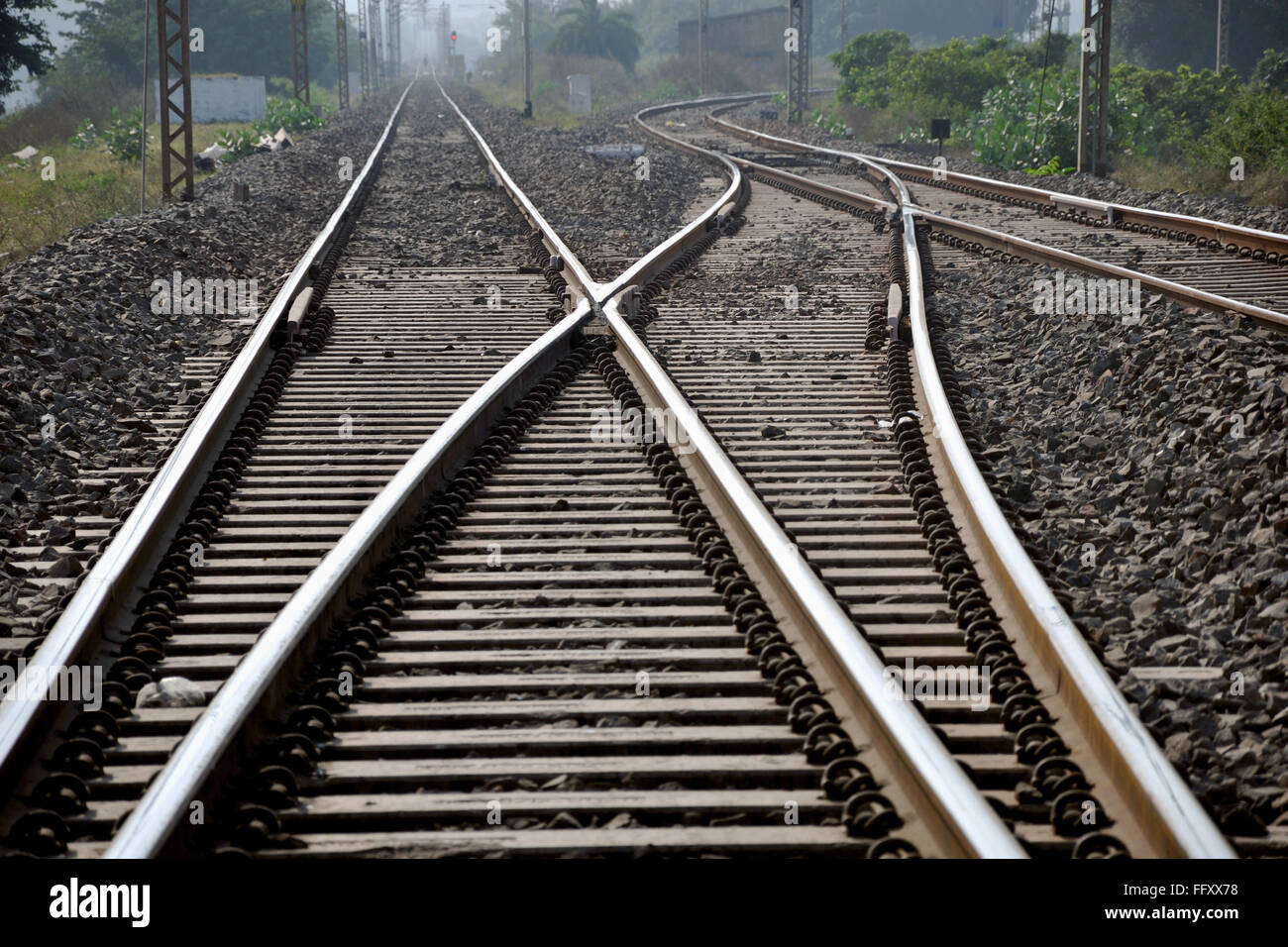 Railway track crossing , railroad track crossing , rail track crossing , railway track , Stock Photo
