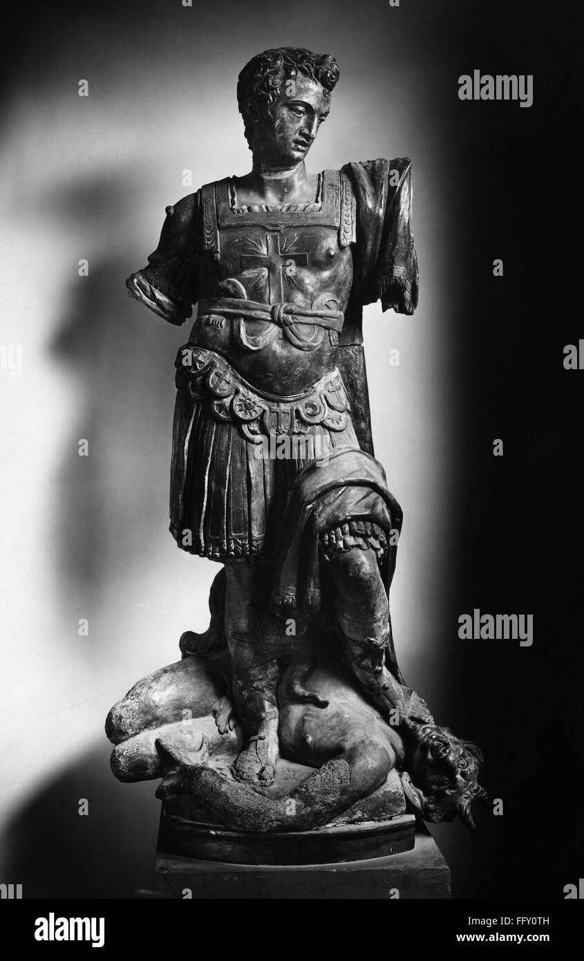 SAINT AND DEVIL. /nA Catholic saint crushing a devil. Terracotta statue, Italian, 15th or 16th century. Stock Photo