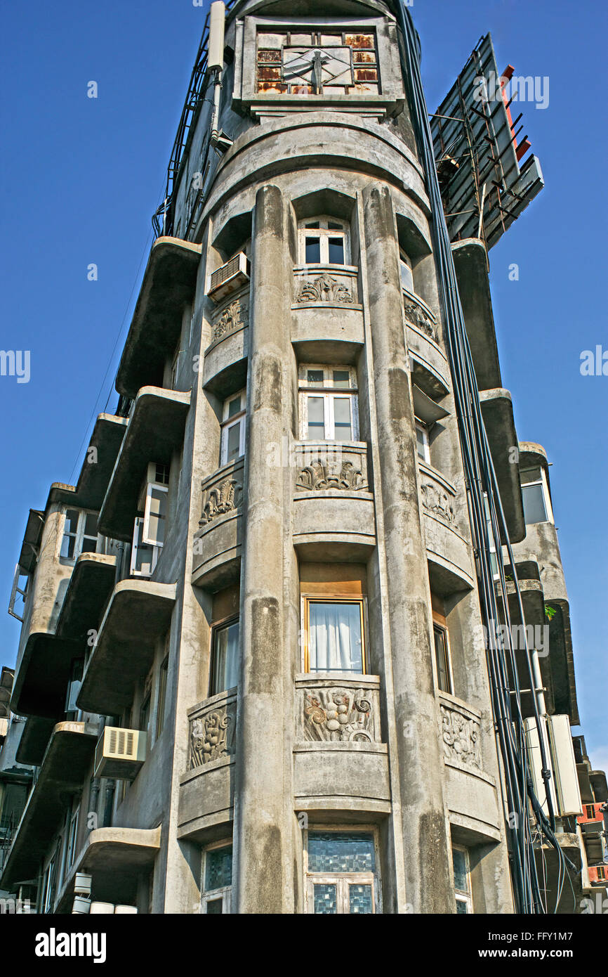 Heritage Art Deco building with clock tower between two Road , Chowpaty , Bombay Mumbai , Maharashtra , India Stock Photo
