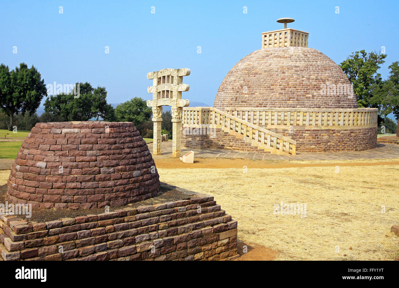 Stupa 3 wall encircling and stapes to go up with gateway and similar in design with smaller stupa Sanchi Bhopal Madhya Pradesh Stock Photo