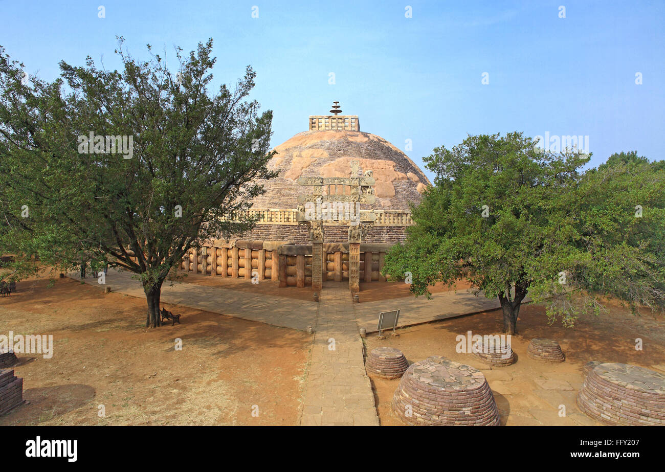 Stupa 1 wall encircling and stapes to go up with eastern gateway with smaller stupas foreground  Sanchi Bhopal Madhya Pradesh Stock Photo