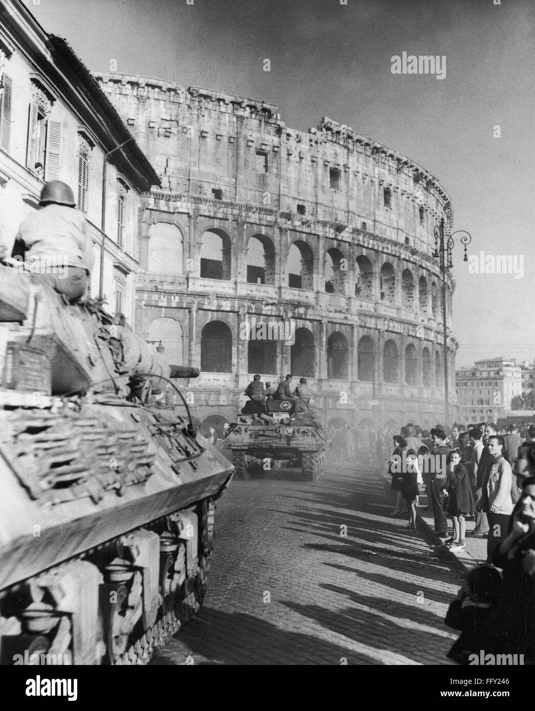 WORLD WAR II COLOSSEUM. /nAmerican troops of the Fifth Army pass the Colosseum in Rome at the