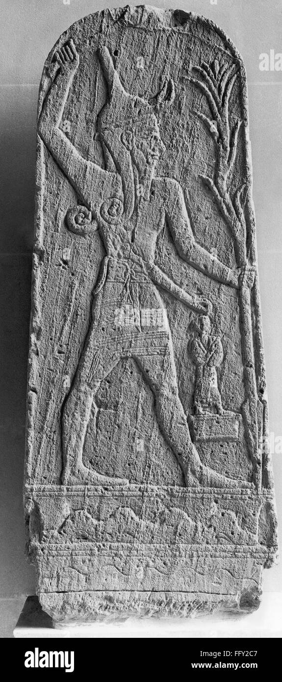 MYTHOLOGY: BAAL. /nSandstone stele depicting the storm god Baal, weiding a mace and a spear, from Ugarit, 14th-13th century B.C. Stock Photo