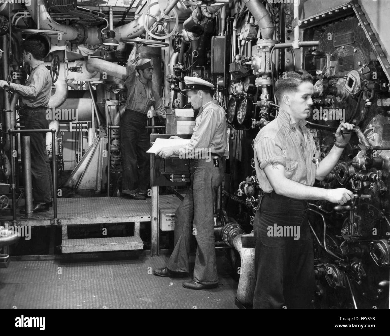 USS YORKTOWN BOILER ROOM. /nCrewmen stand by controls in the boiler
