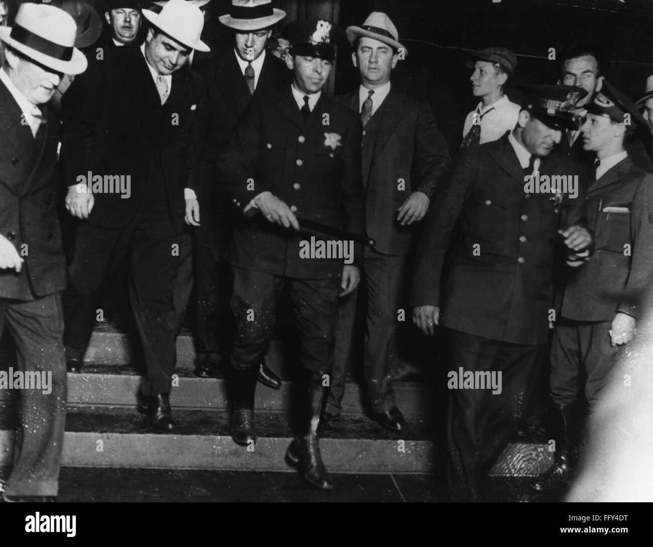 ALPHONSE CAPONE (18991947). /nAmerican gangster. Capone (at left, in