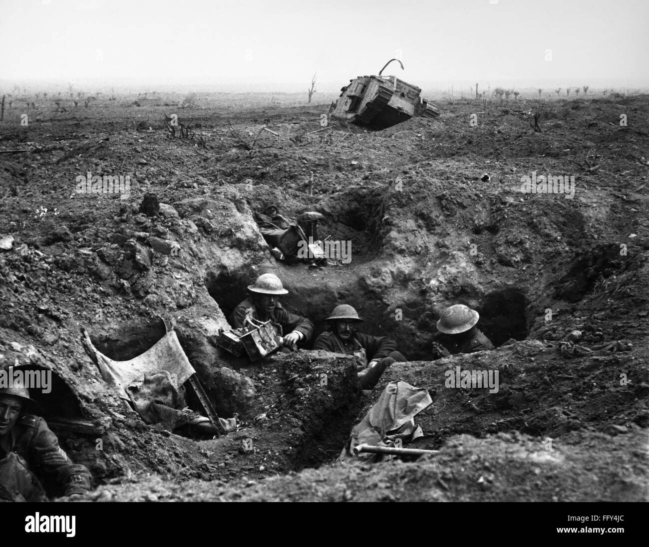 WORLD WAR I: YPRES, 1917. /nBritish troops in a gun-pit trench with a destroyed Mark IV tank in the background. Photographed during the battle at Menin Road Ridge, part of the Battle of Ypres, 22 September 1917. Stock Photo