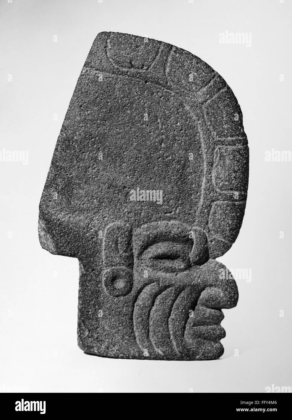 MEXICO: TOTONAC HEAD. /nThin stone head in the style of the Totonac culture. From Tlaxcala, Mexico. Stock Photo