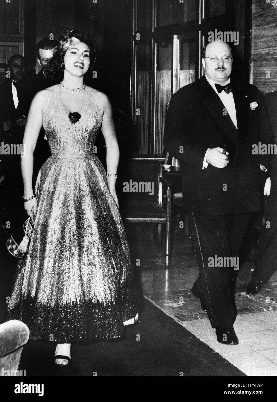 FAROUK I (1920-1965). /nKing of Egypt, 1936-1952. The exiled former king photographed in Monte Carlo with Italian opera singer Irma Capece Minutolo (1935- ), 16 February 1954. Stock Photo