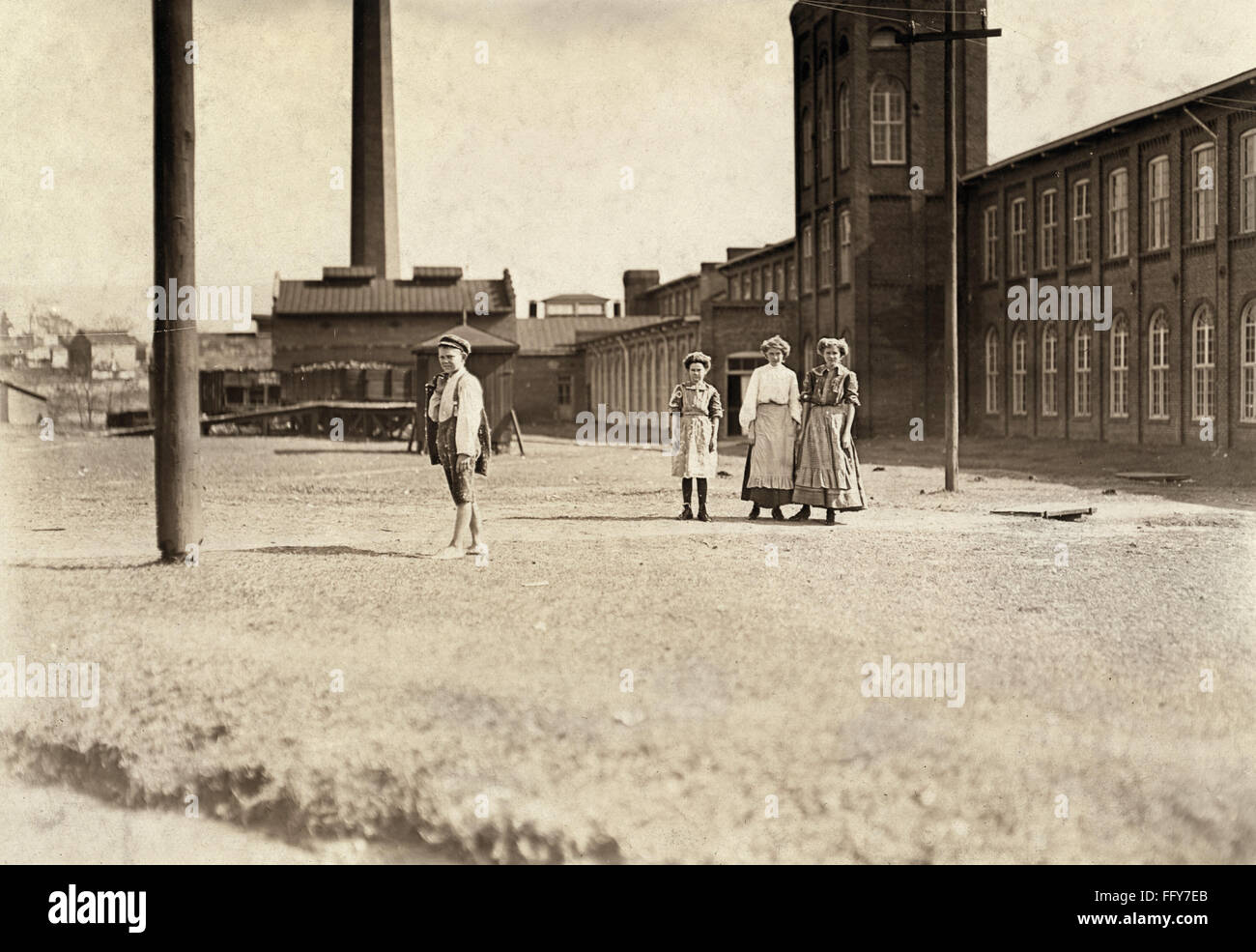 HINE: CHILD LABOR, 1909. /nYoung textile mill workers in front at the Manchester Cotton Mills in Macon, Georgia. Photograph by Lewis Hine, January 1909. Stock Photo