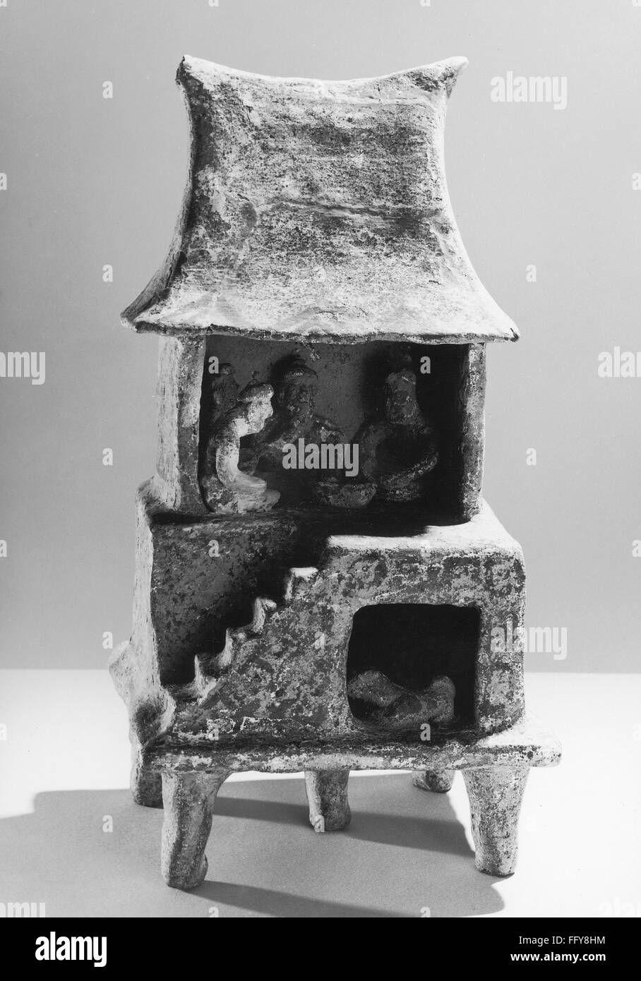 MEXICO NAYARIT HOUSE. /nCeramic sculpture of people inside a house or