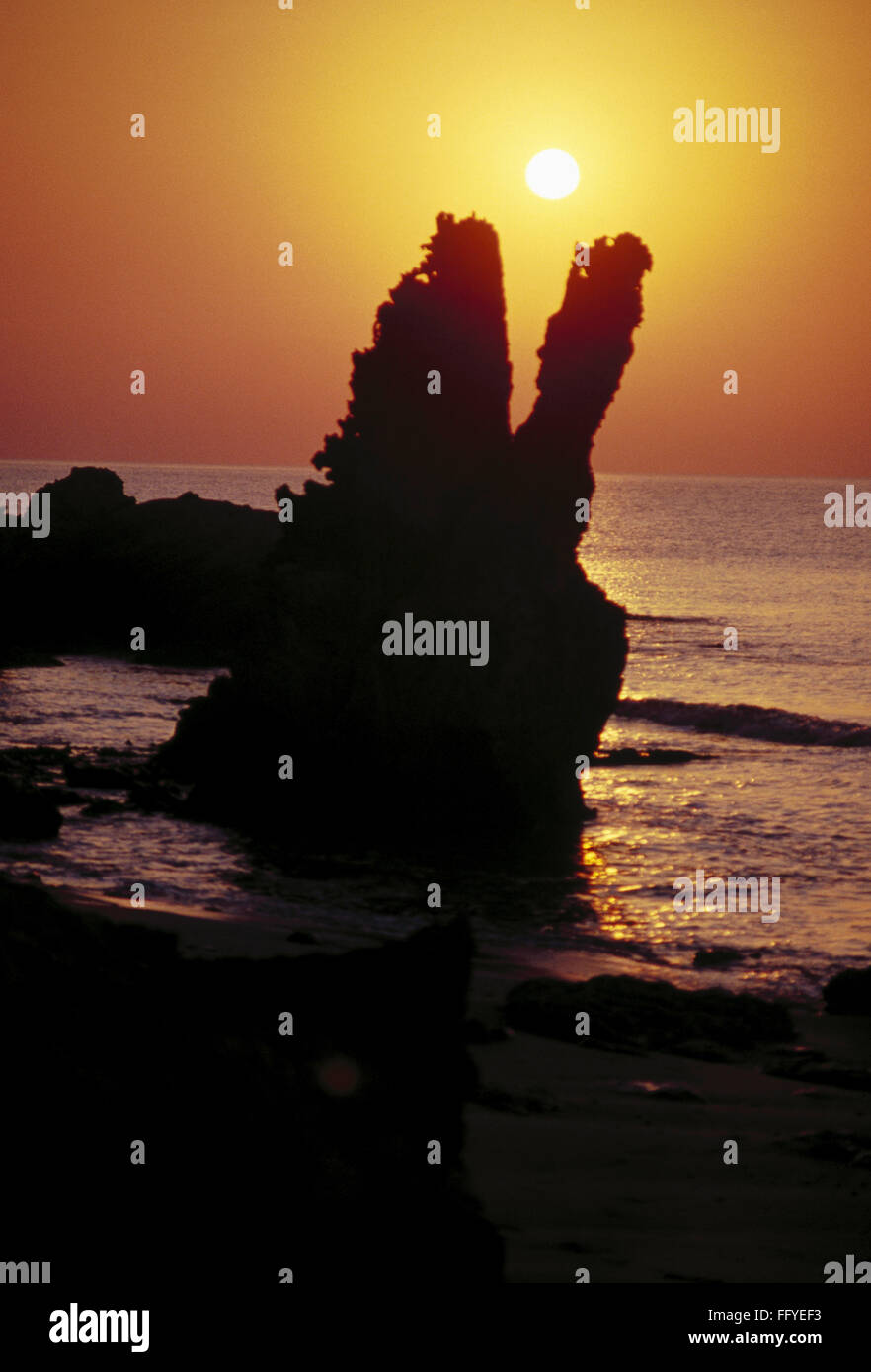 Sunrise at Sea stack , rocky pillar at Saurashtra , Gujarat , India Stock Photo