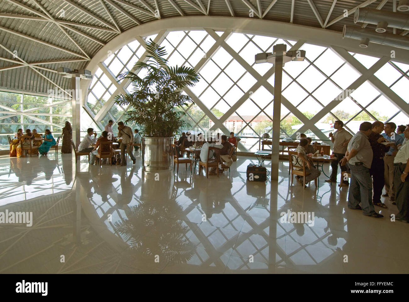 Passengers in cafeteria of chhatrapati shivaji international airport ; Santacruz ; Bombay Mumbai ; Maharashtra ; India Stock Photo