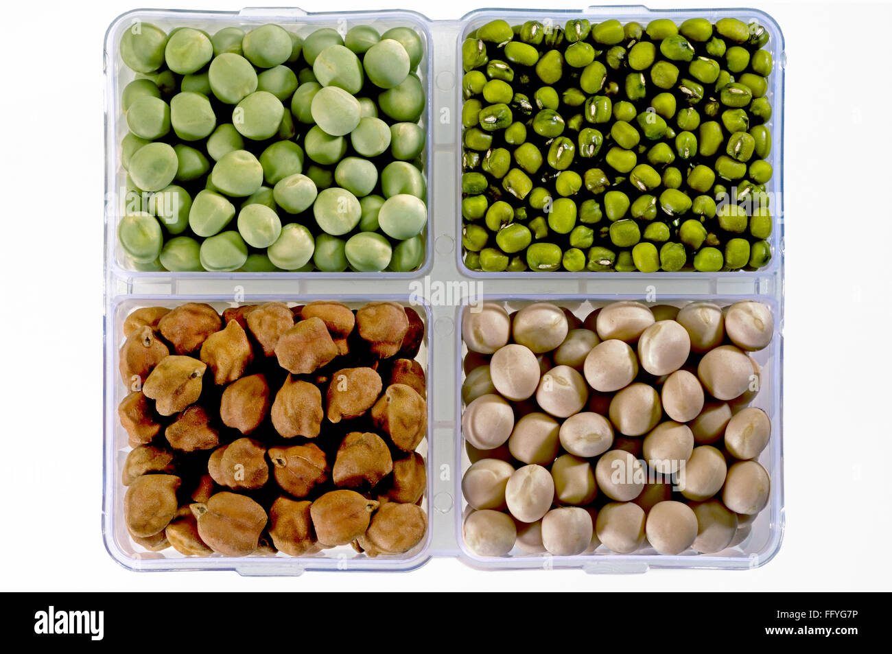 Pulses green peas green gram black chickpeas and white peas in square dish ; India Stock Photo