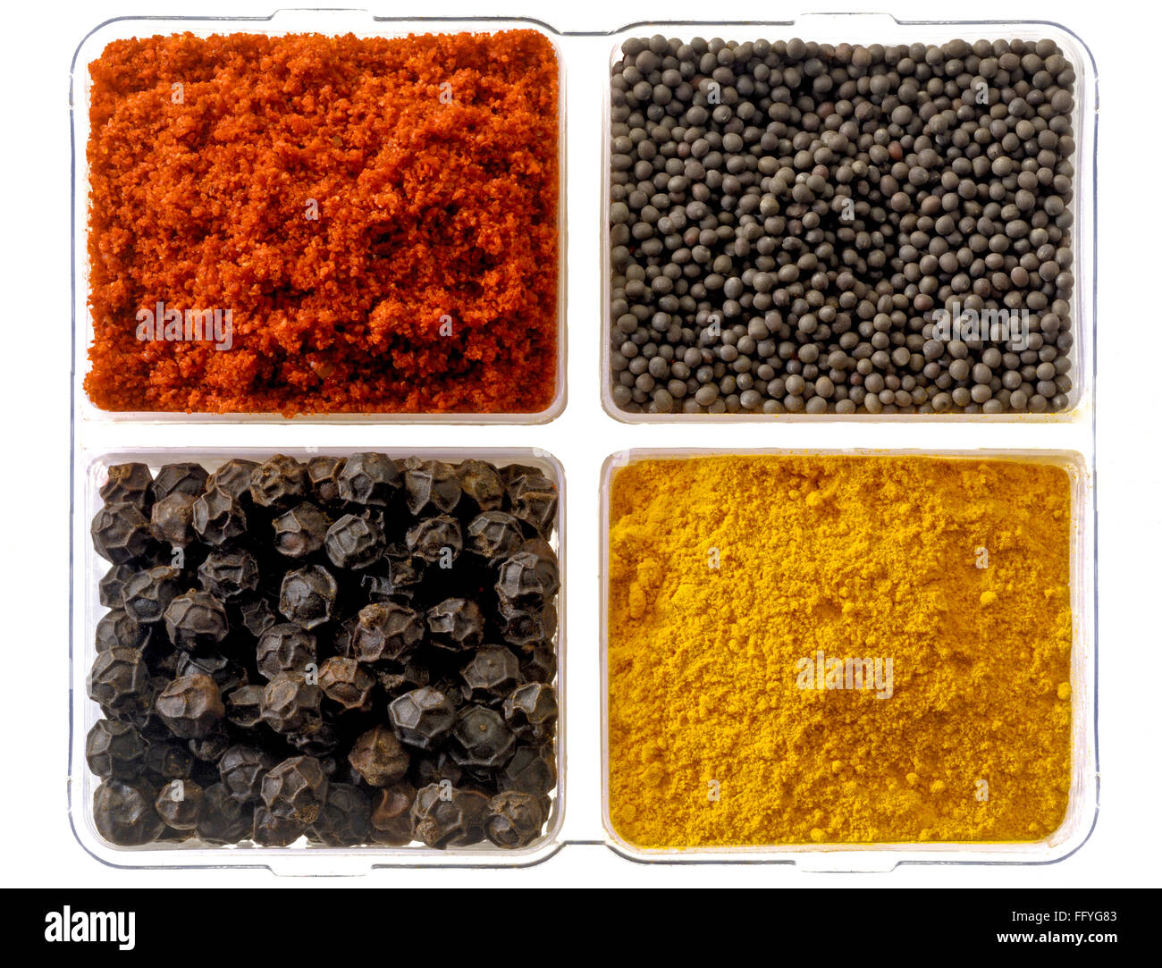 Spices chilly and turmeric powder mustard seeds and black pepper ; India Stock Photo