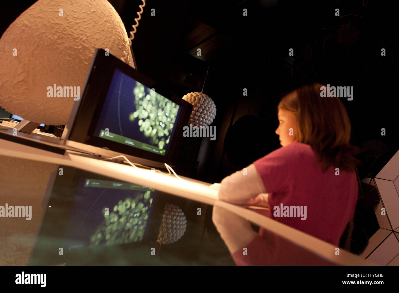 Tile Image Of Girl Using Computer At Science Museum Stock Photo