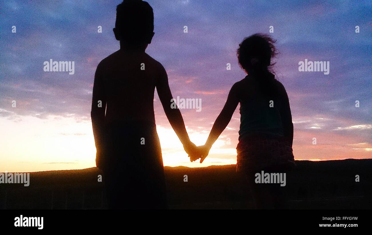Boy girl holding hands hi-res stock photography and images - Alamy