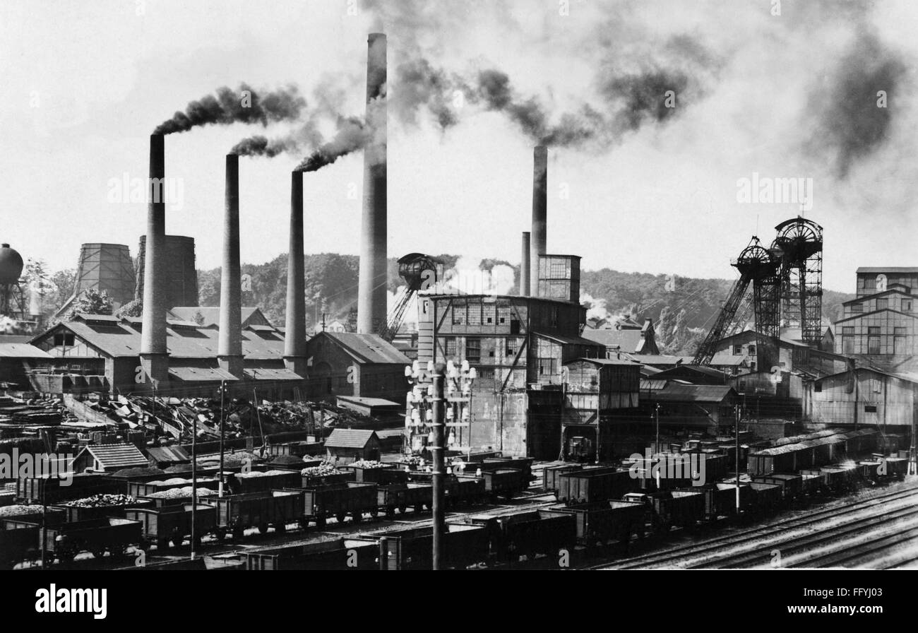 mining,coal mining,Reden mine,Schiffweiler,20th century,Germany,Saarland,hard coal,pit coal,bituminous coal,black coal,coal,coals,chimney,chimneys,fume,fuming,smoking,smoke,goods wagon,freight cars,goods wagons,boxcars,boxcar,box car,gondola,freight car,coal-mine,mining company,coal mining,mining industry,opencast mining,open-pit mining,open-cut mining,underground mining,deep mining,railway,railroad,railways,railroads,track vehicle,track vehicles,driving machine,vehicle,vehicles,means of transportation,means of tran,Additional-Rights-Clearences-Not Available Stock Photo
