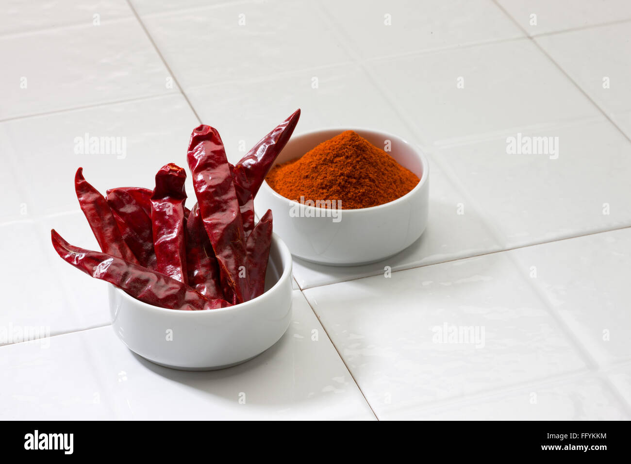 dry red chilli and chilli powder in bowl Stock Photo