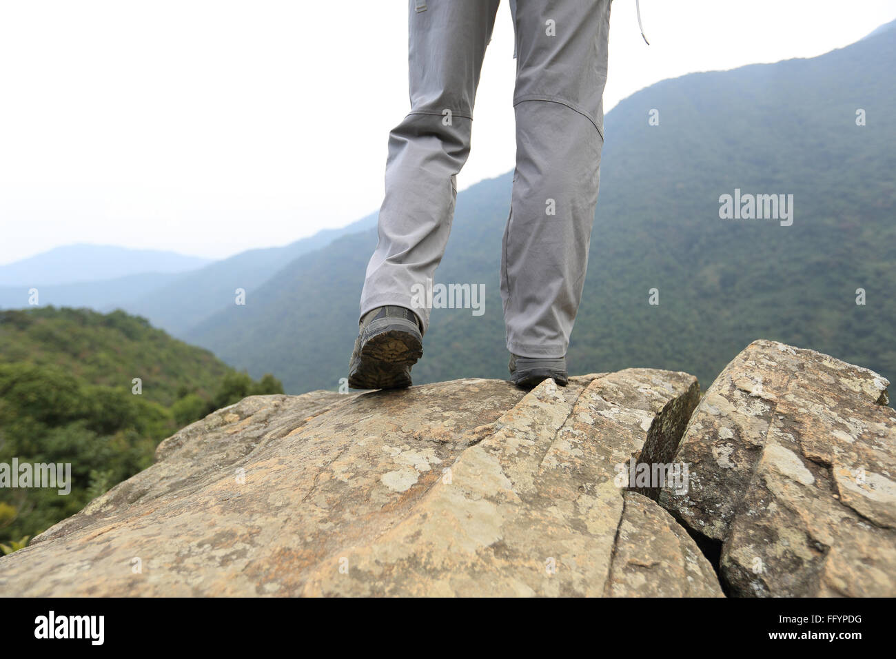 young woman hiker hiking at mountain peak Stock Photo - Alamy