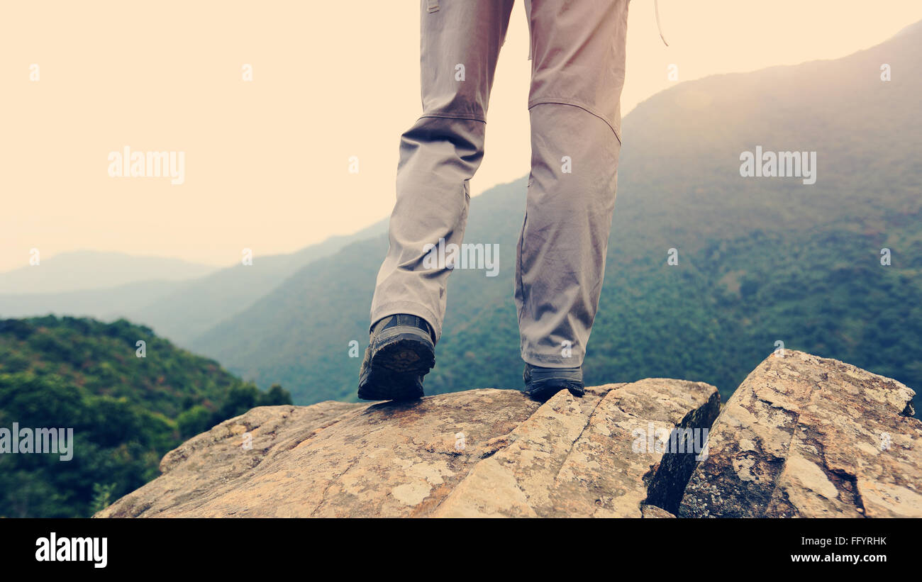 young woman hiker hiking at mountain peak Stock Photo - Alamy