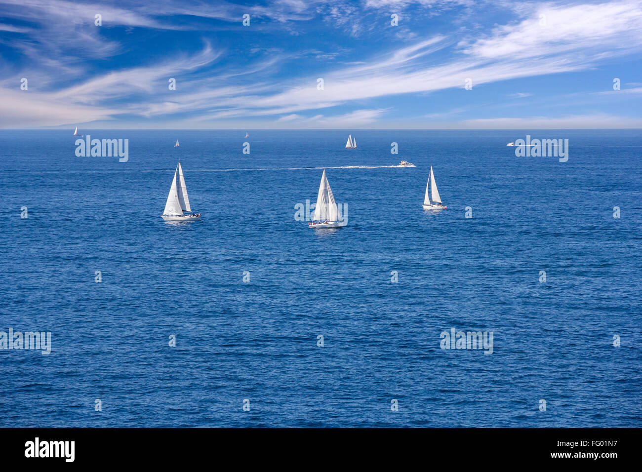 A Lot of white yacht sailing in the blue sea Stock Photo - Alamy