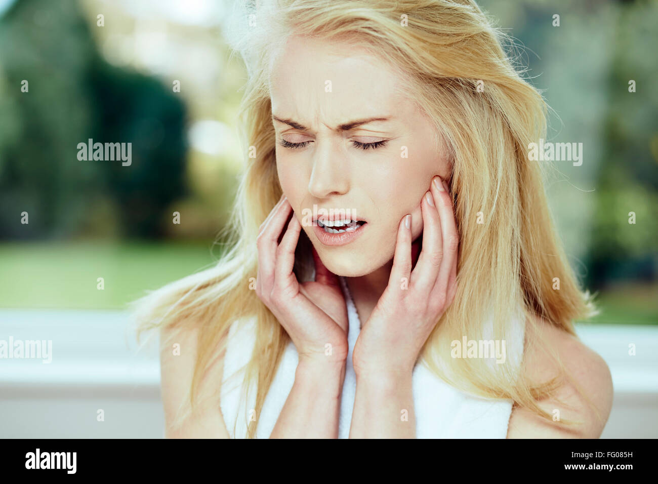 Girl with toothache Stock Photo