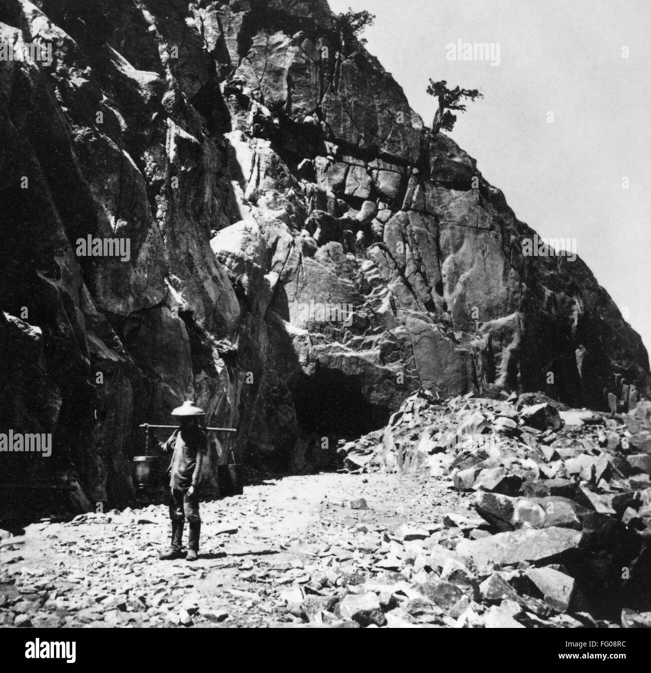 RAILROAD CONSTRUCTION. /n'Heading of east portal Tunnel No. 8.' A Chinese man working on the construction of the Central Pacific Railroad in the Sierra Nevada mountains, California. Photograph by Alfred Hart, c1868. Stock Photo