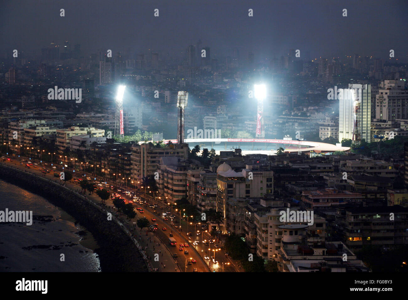 Marine Drive and Wankhede Stadium at night Bombay Mumbai Maharashtra India Asia Indian stadium floodlights stadium spotlights high-mast lights stadium Stock Photo