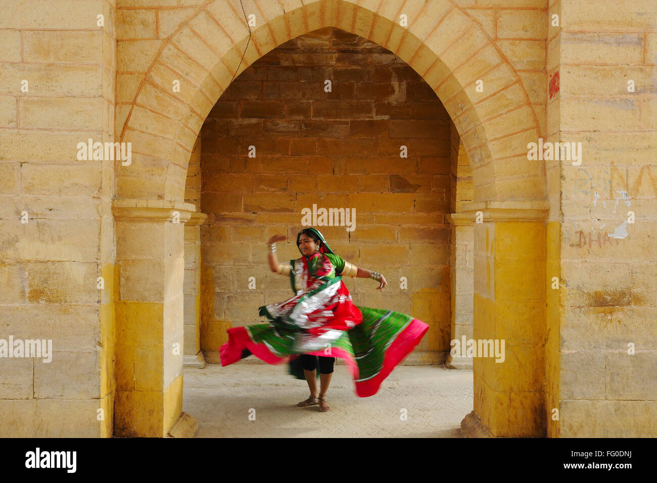 Lady dancing at Gadsisar Gadisar lake structure ; Jaisalmer ; Rajasthan ; India MR#772C Stock Photo