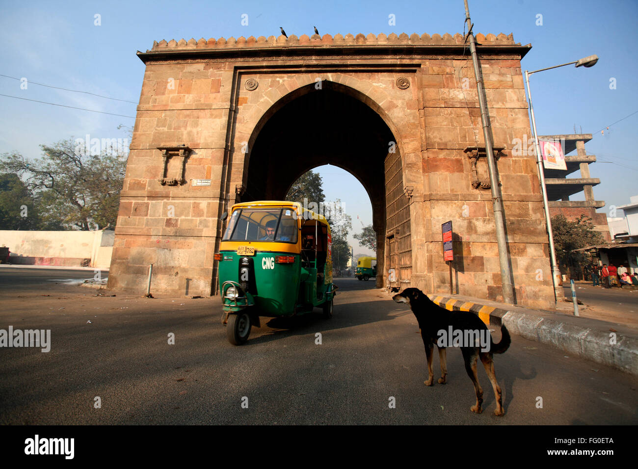 Auto rickshaw passing through Prem darwaja part of Bhadra fort situated in old Ahmedabad ; Gujarat ; India Stock Photo