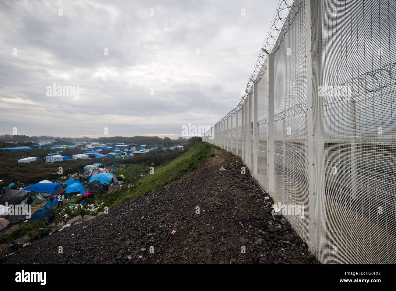 A high security fence overlooking the Jungle Refugee Camp in Calais