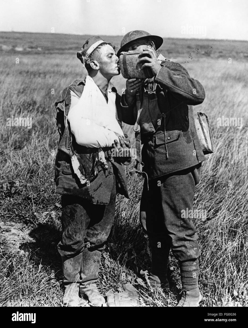 WORLD WAR I WOUNDED nA Scottish Guardsmen Gives A Wounded Soldier A