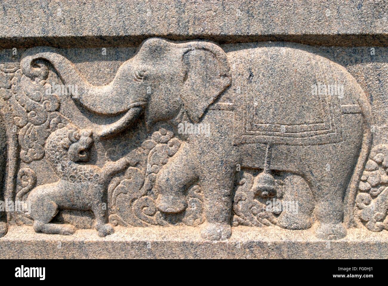 Elephant fighting with Lion relief stone carving on wall of Swami Vivekananda Rock Memorial Mandapam Kanyakumari Tamil Nadu Stock Photo