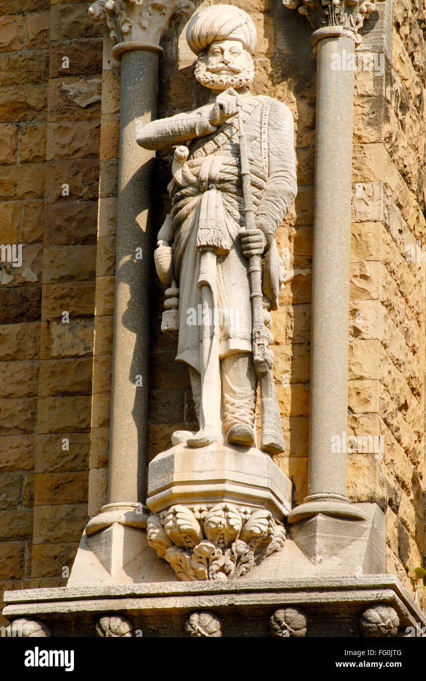 Richly carved human figure local man on Rajabai tower clock tower University of Mumbai , Bombay Mumbai , Maharashtra Stock Photo