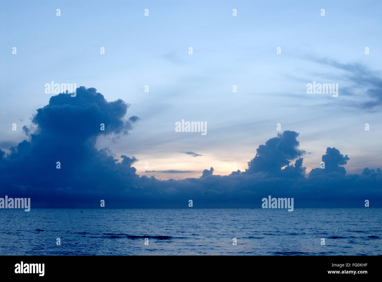 Colourful sunrise behind dramatic formation of clouds Palk Bay , Ramehswaram , Tamil Nadu , India Stock Photo