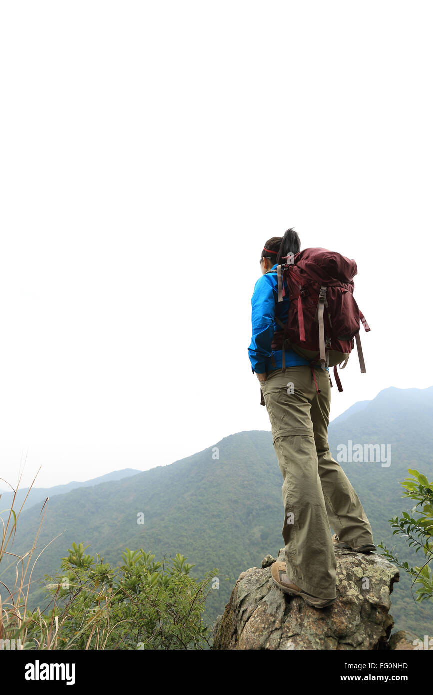 young woman backpacker hiking at mountain peak Stock Photo - Alamy
