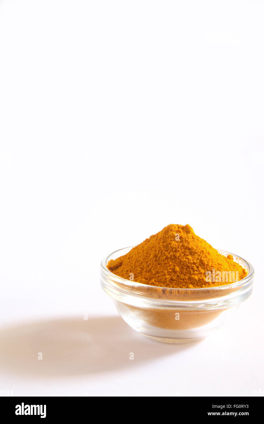 Indian spice , Turmeric powder Haldi Curcuma Longa in bowls on white background Stock Photo