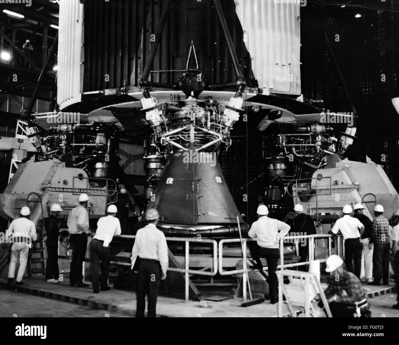 APOLLO 8: SATURN V ROCKET. /nEngineers checking the Saturn V first stage rocket at the Vehicle Assembly Building at Kennedy Space Center in Florida, prior to the launch of the Apollo 8 mission. Photograph, 1968. Stock Photo