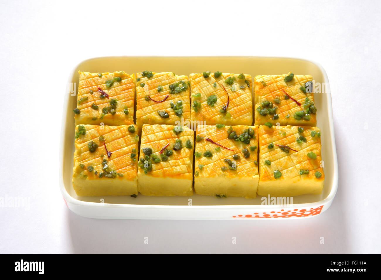 Indian sweet , sandesh bengali mithai garnish with pistachio and