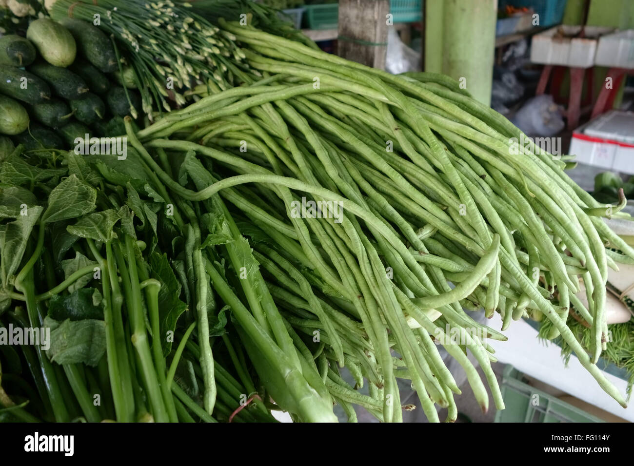 Yardlong beans and other vegetables on a stall in Bangkok, Thailand Stock Photo