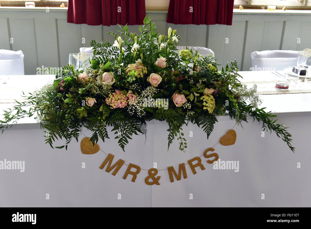 Top table at a wedding breakfast for the bride and groom, Yorkshire UK Stock Photo