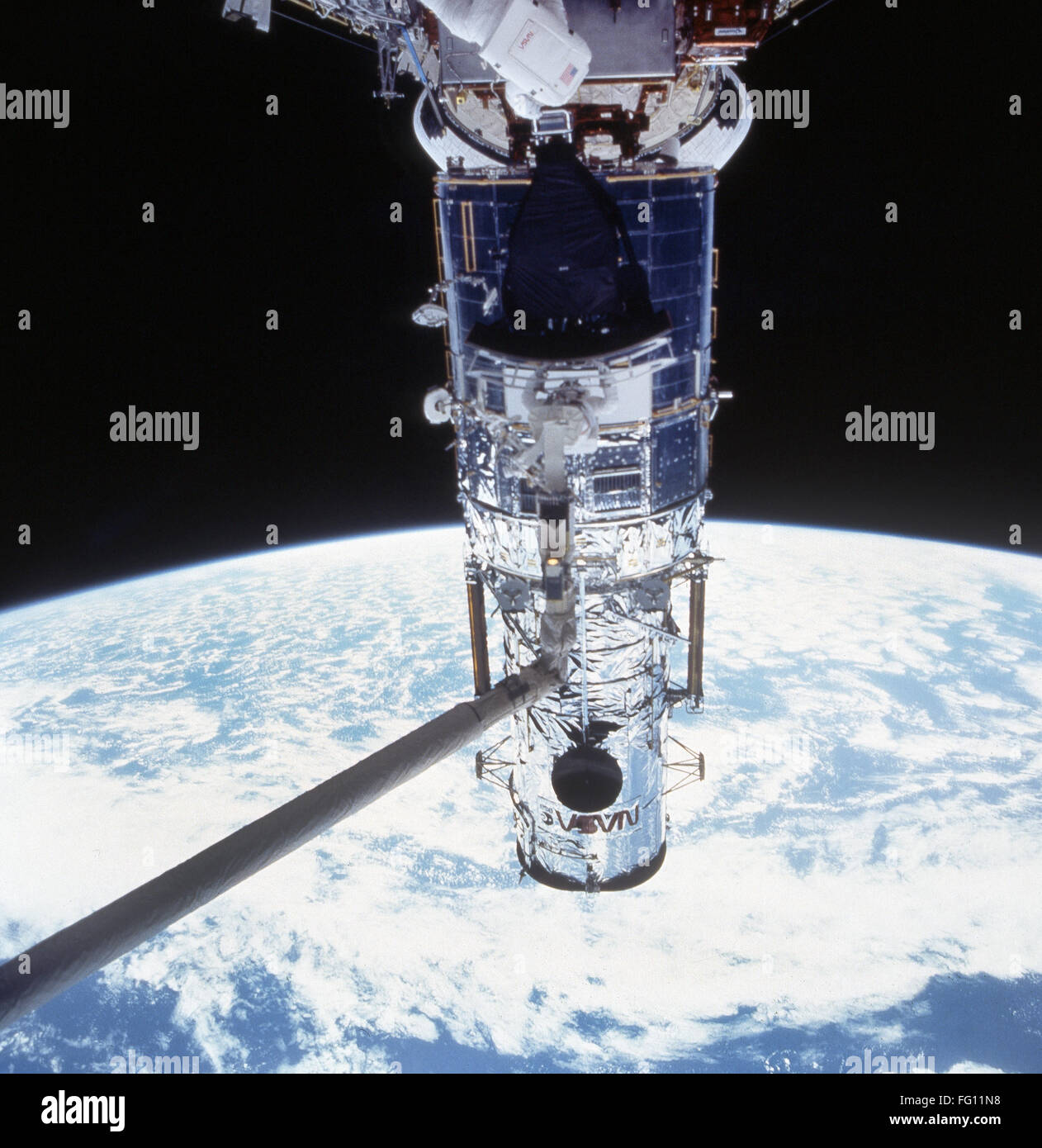 HUBBLE SERVICING, 1993. /nAmerican astronaut Jeffrey Hoffman, anchored to the Space Shuttle