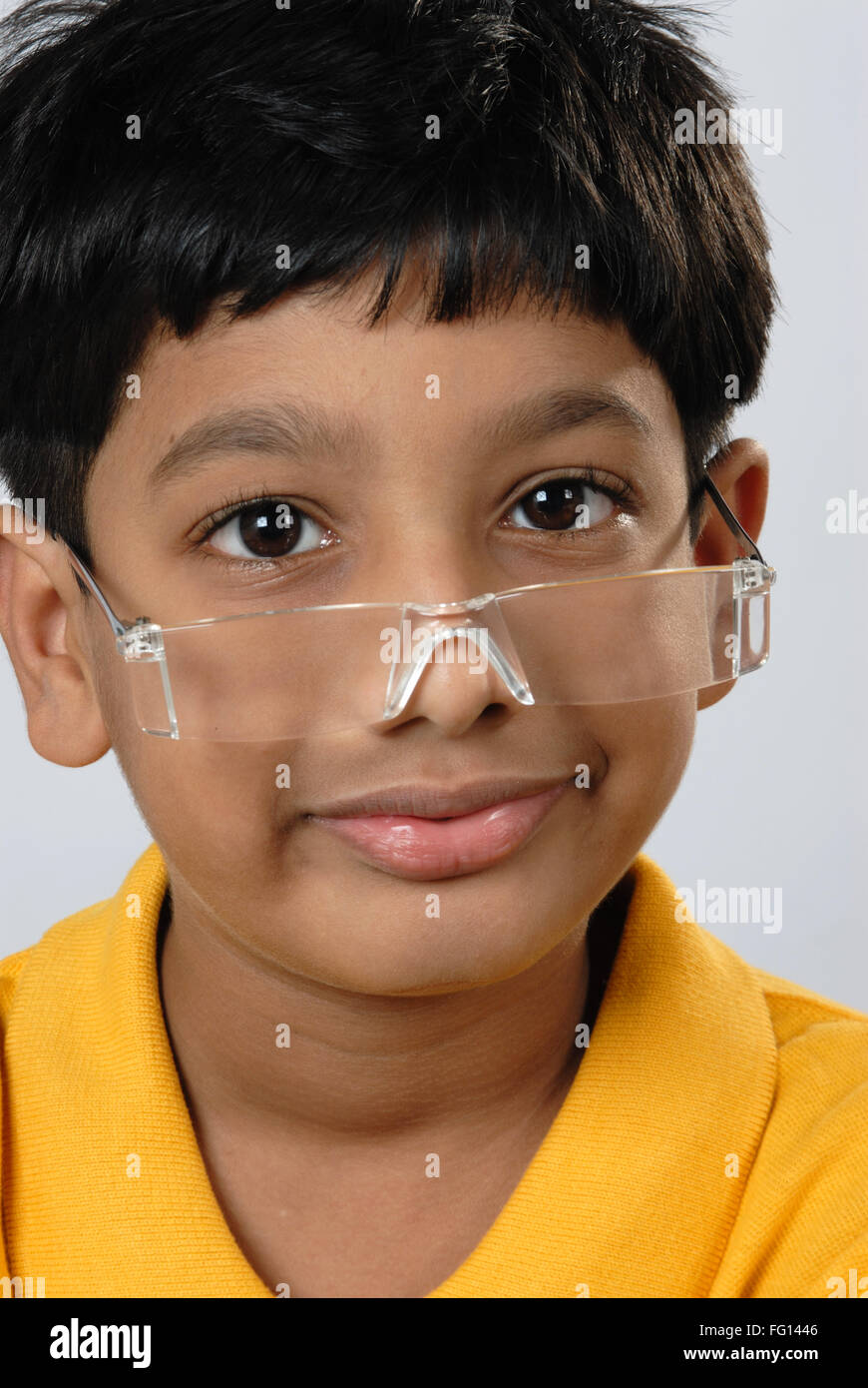 Indian boy wearing spectacles looking hires stock photography and