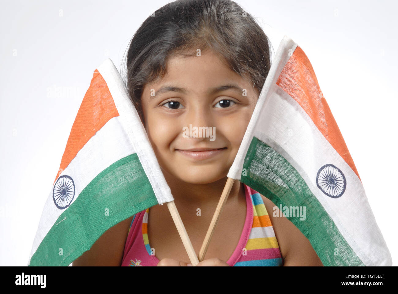 South Asian Indian girl holding two flags of India MR682N Stock Photo