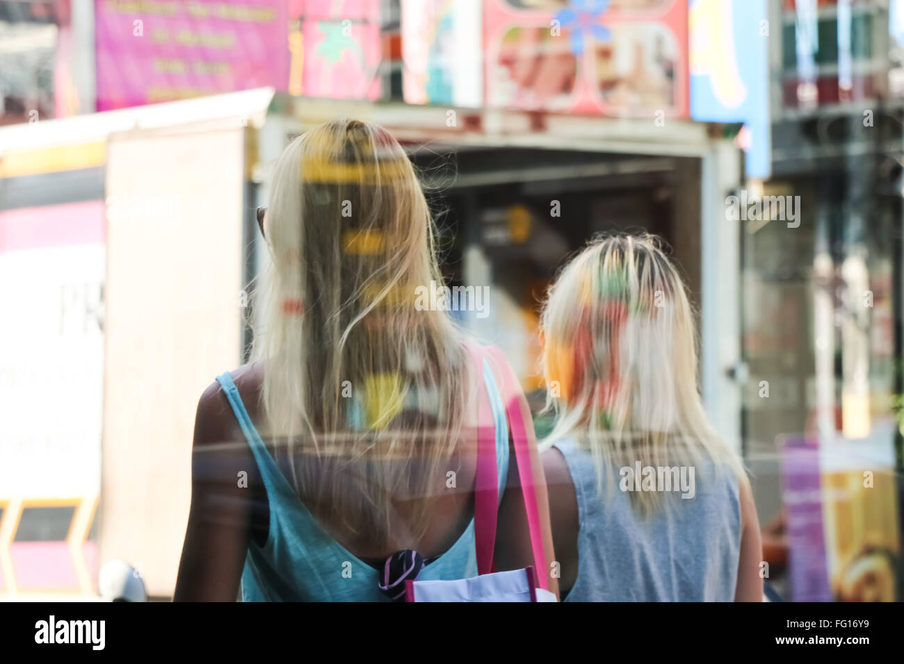 Two women rear view hi-res stock photography and images - Alamy