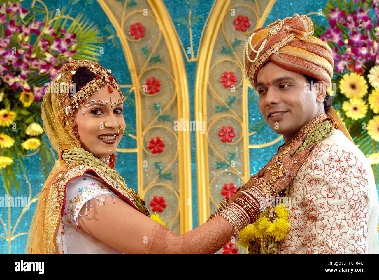 Hindu wedding Tikka ceremony woman garlanding man MR#364 Stock Photo