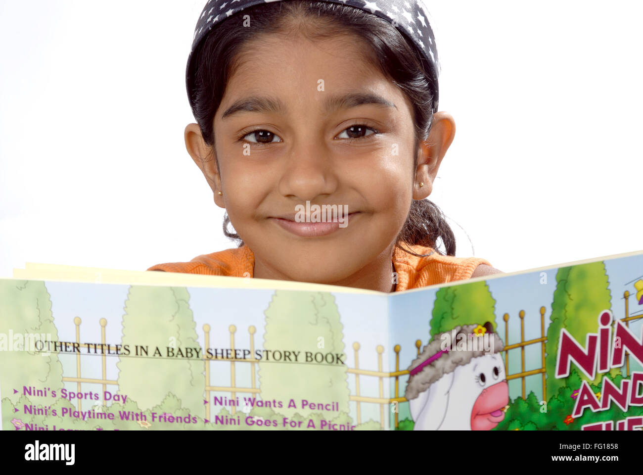 Girl holding book studying MR#152 Stock Photo